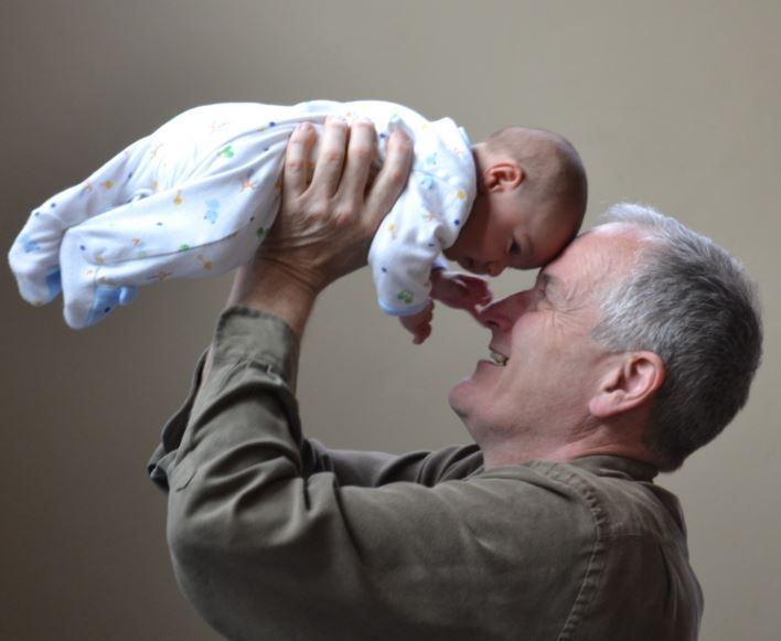 Grandparent and grandchild playing